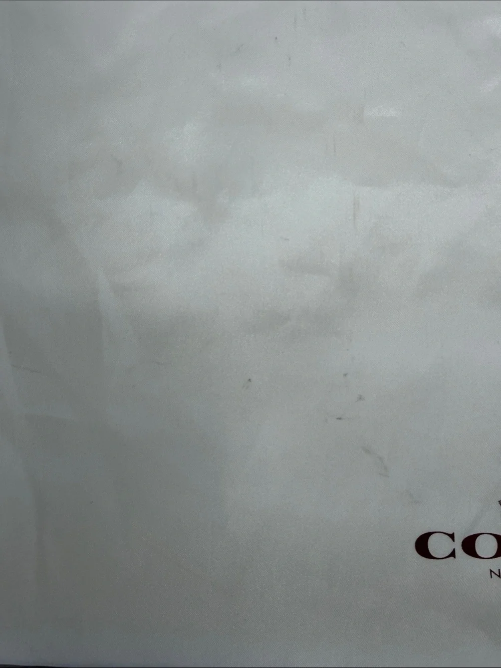 Coach 23” x 19” satin dust bag in white with brown lettering, GUC